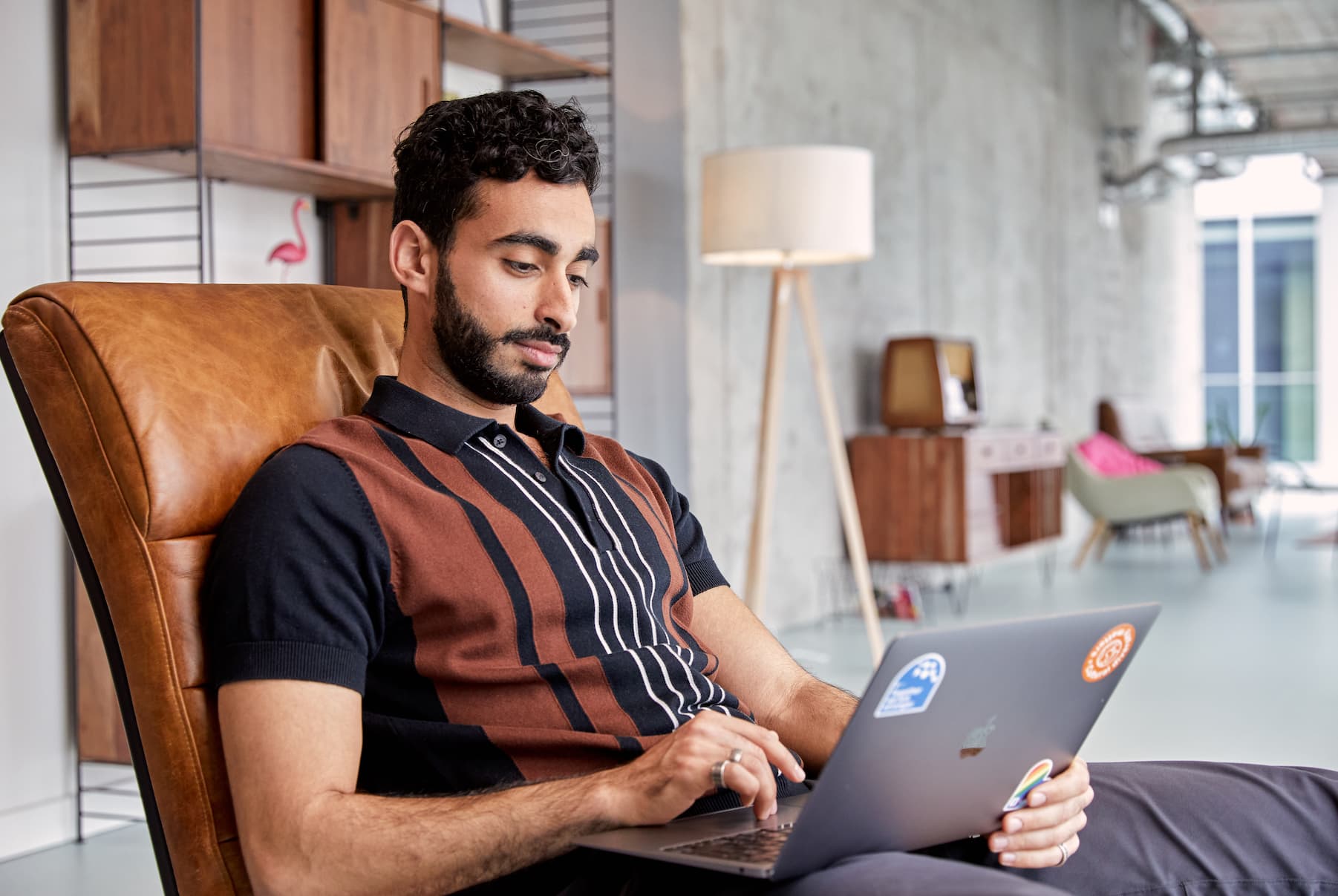 Person staring into computer, looking very concentrated